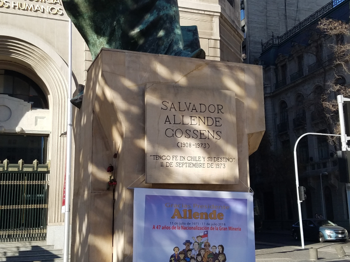 Statue with flowers at base